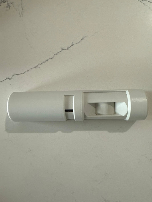 Technician installing a Request-to-Exit (REX) motion sensor above an access-controlled commercial door in Austin, Texas — code-compliant fail-secure system preventing magnetic lock safety issues.